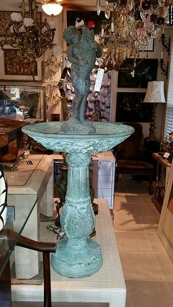 Turquoise verdigris bird bath fountain in the showroom