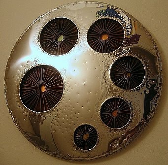 Round silver disc wall art sculpture