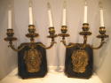 Bronze mask sconces